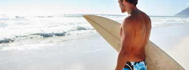 Man With Surf Board Cover Photo