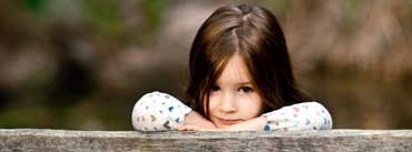 Child Sitting On A Bench Cover Photo